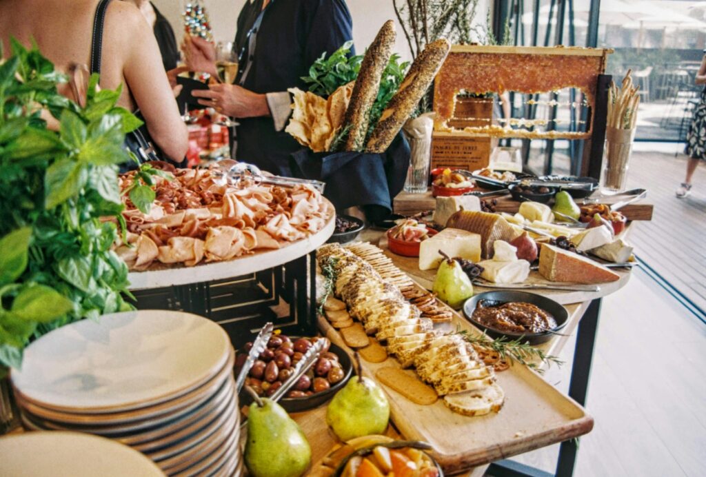 A variety of food displayed on a table in a buffet-style brunch