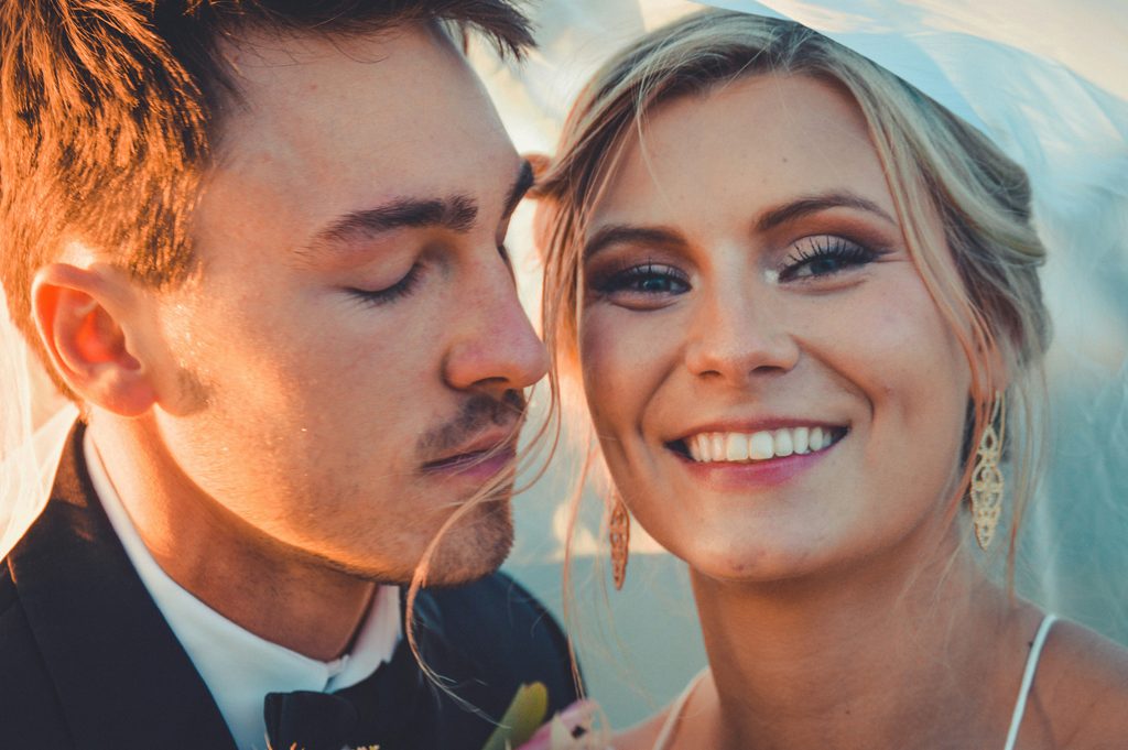 A bride smiling.