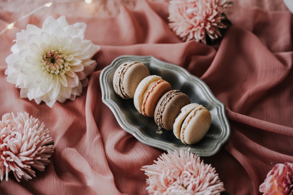 A dish of multi-colored macarons.