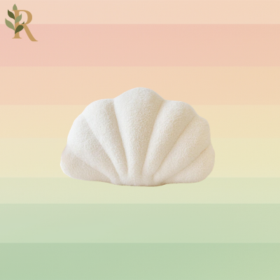 A white seashell-shaped pillow.