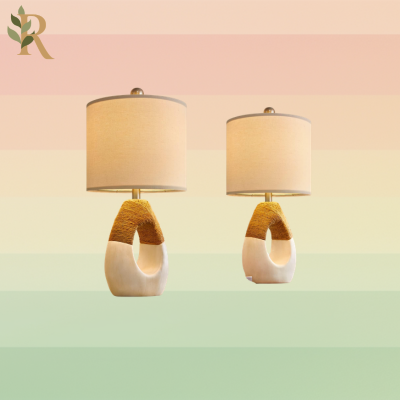 Two white lamps with a woven stripe.