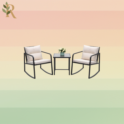 Rocking chairs with cream colored cushions and a black table.