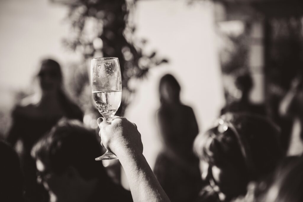 Grayscale image of toasting champagne