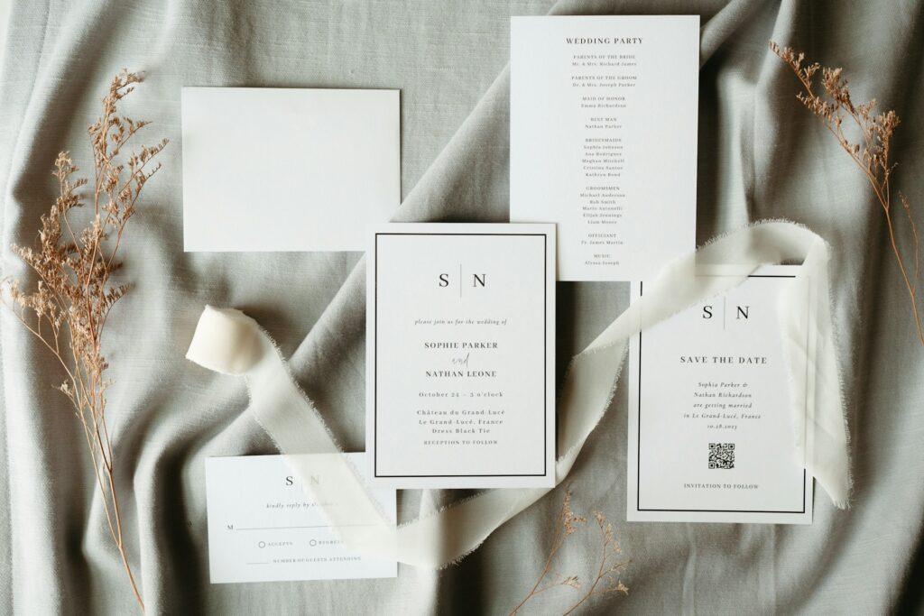 Five pieces of white wedding stationary