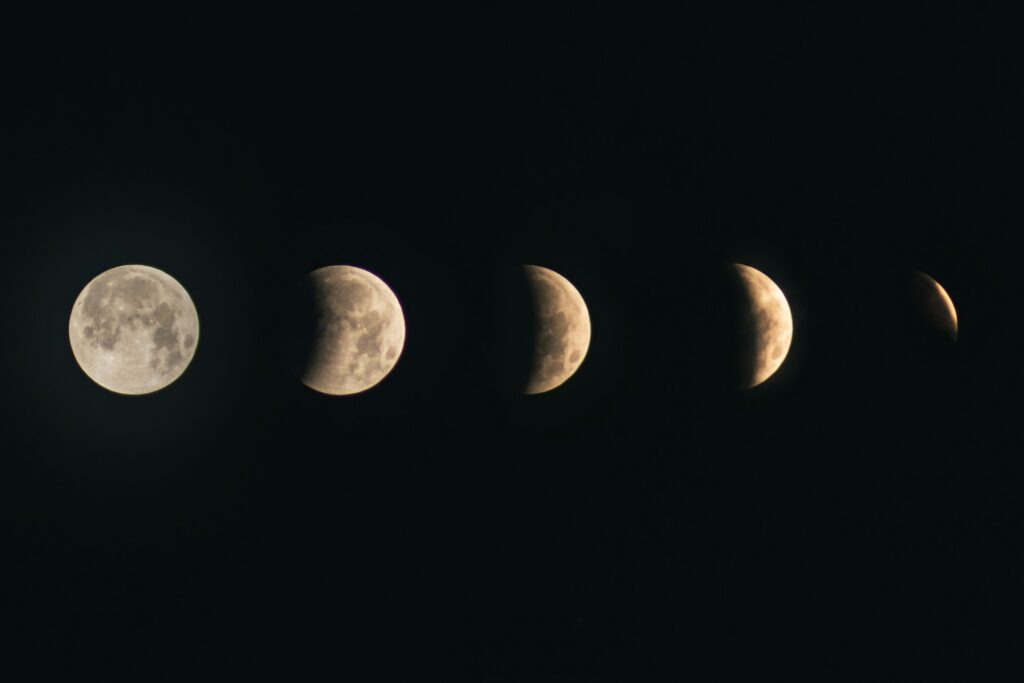 Moon phases against dark background