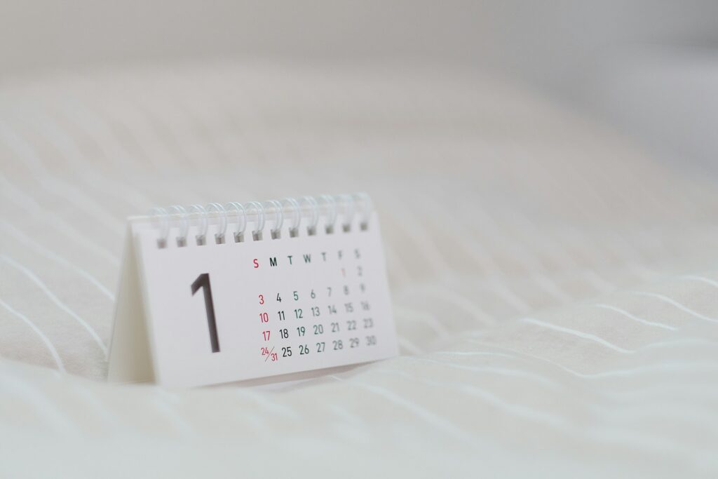 A small white paper calendar