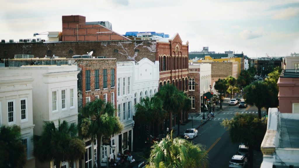 The city skyline of Charleston sits under a cloudy sky. It's among the birthday trip ideas people enjoy considering before traveling for their birthday celebrations.
