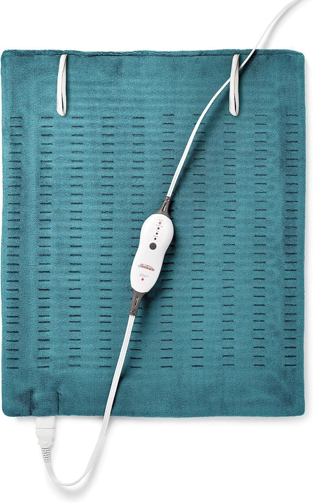 A teal heating pad with the electric controller cord over it.