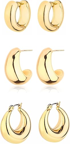 Three sets of chunky gold hoop earrings sit against a white background.