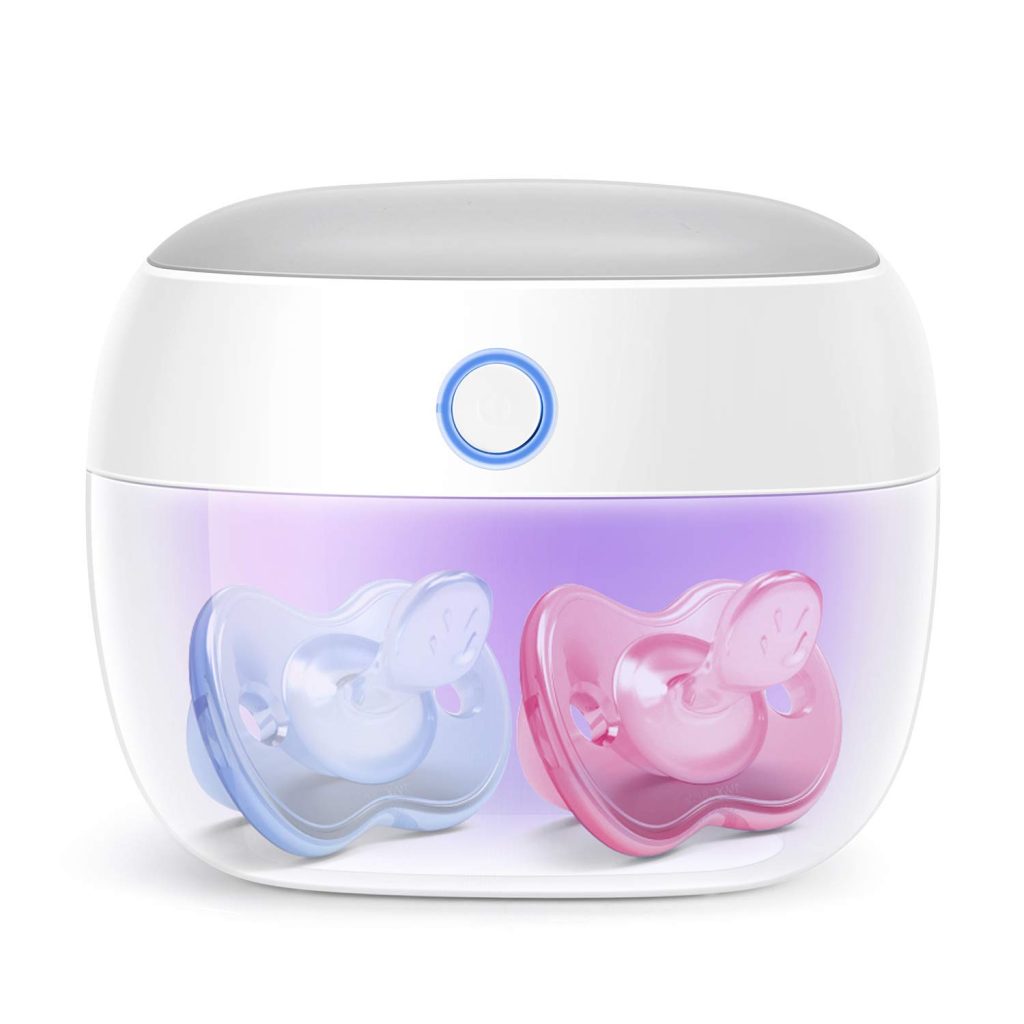 A UV cleaner holding two pacifiers. One is blue and the other is pink.