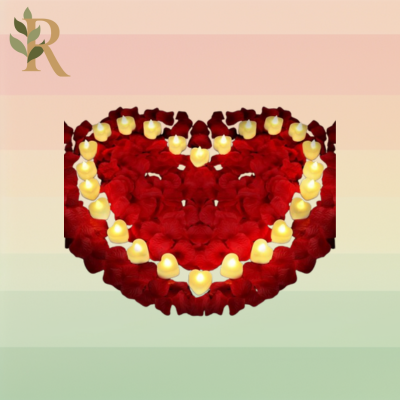 Heart-shaped tea lights and red rose petals sits against the Revivalist striped background in a heart shape.