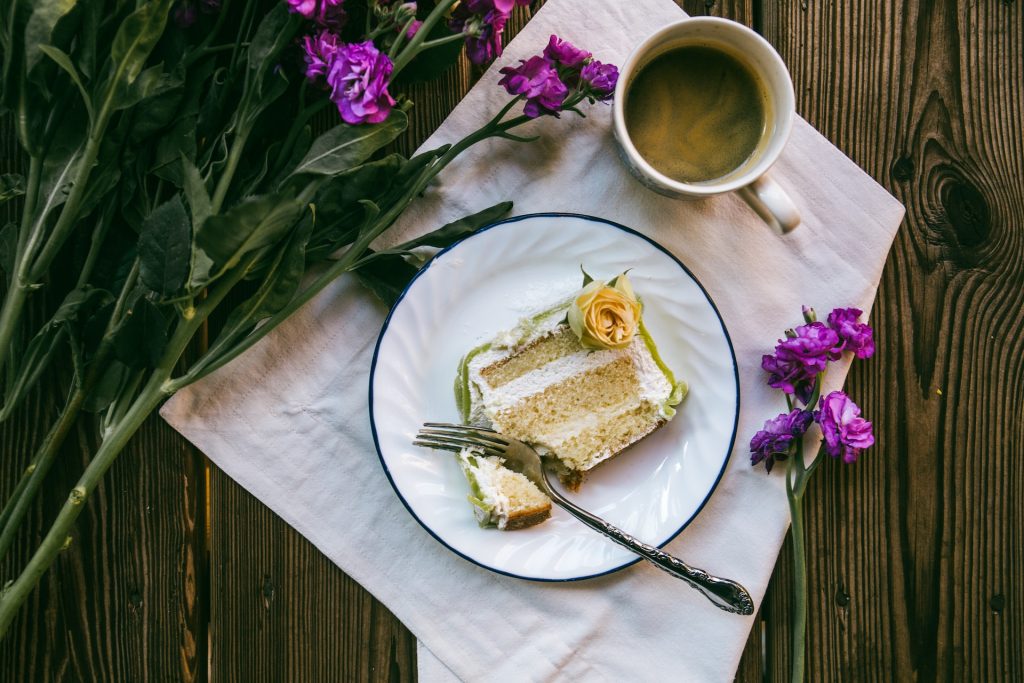 vanilla cake with green icing on a plate