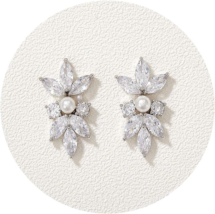 Earrings with pearls surrounded by leaf-shaped diamonds.