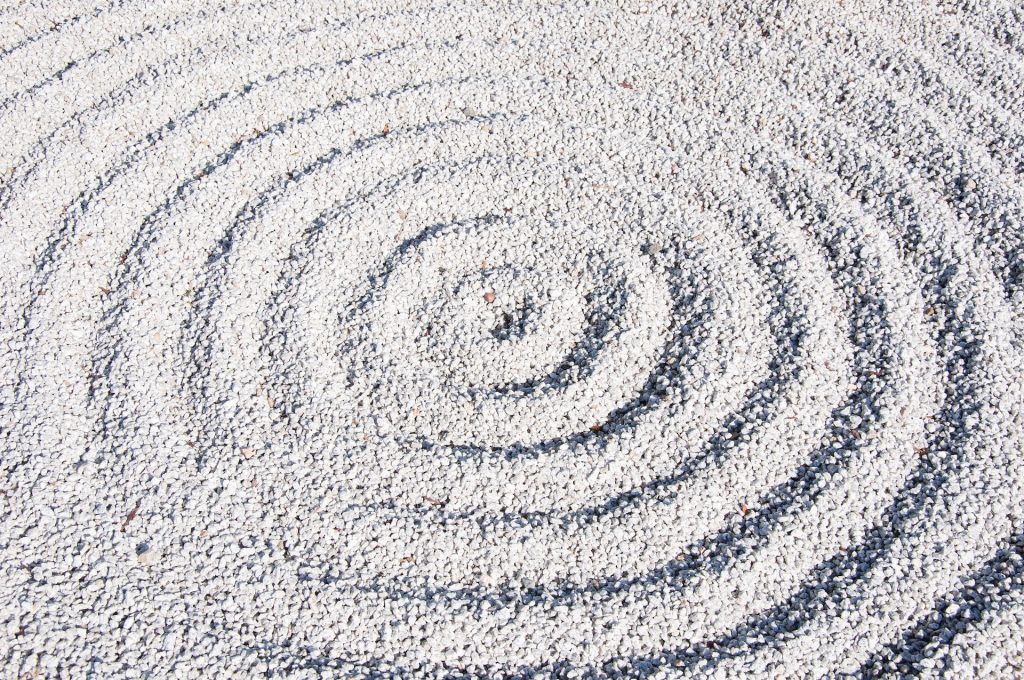 A swirl design in sand.
