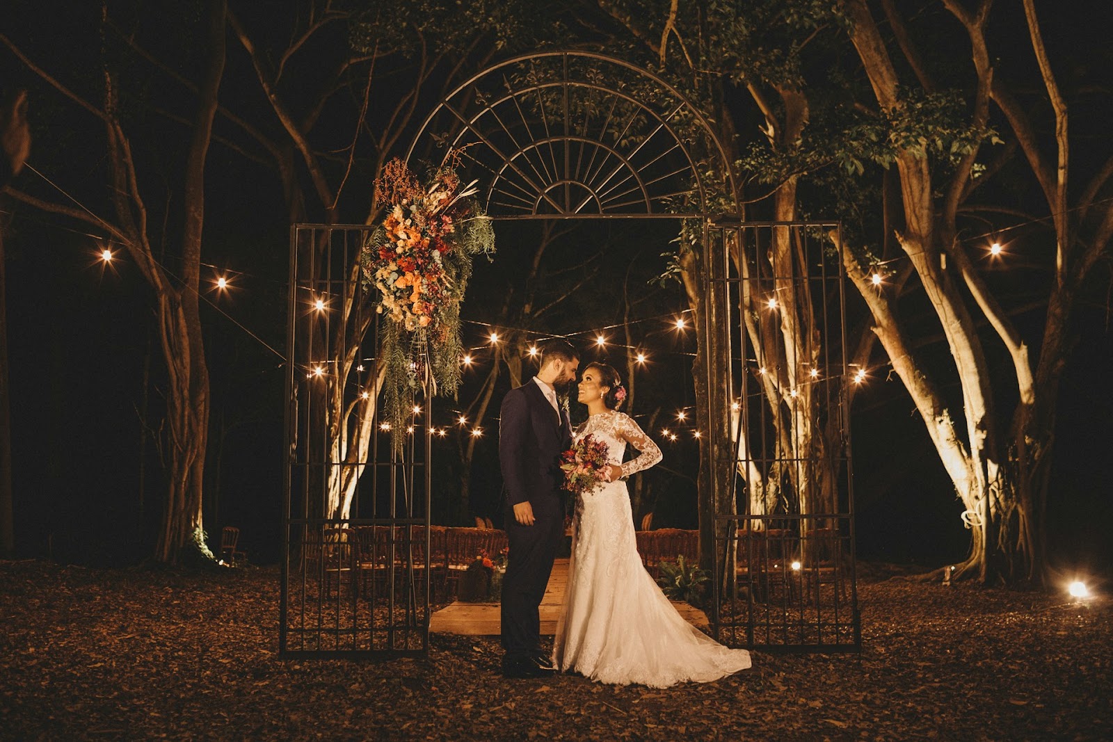 iron gate with light wedding arch ideas
