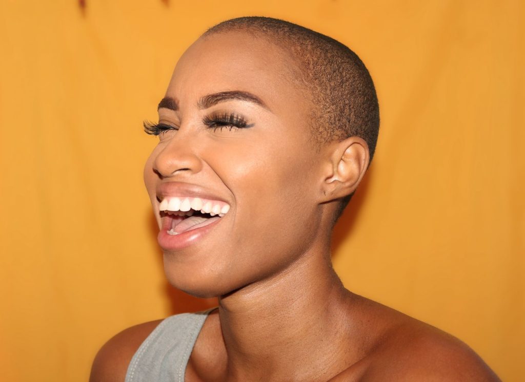A woman smiling.