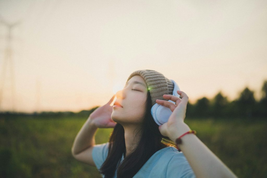 Girl listening to uplifting songs.