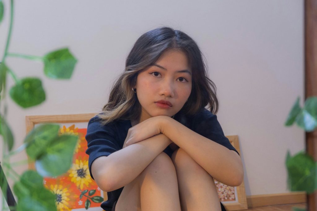 A woman with a sad expression.