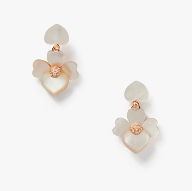 Cream pansy shaped earrings with rose gold center.
