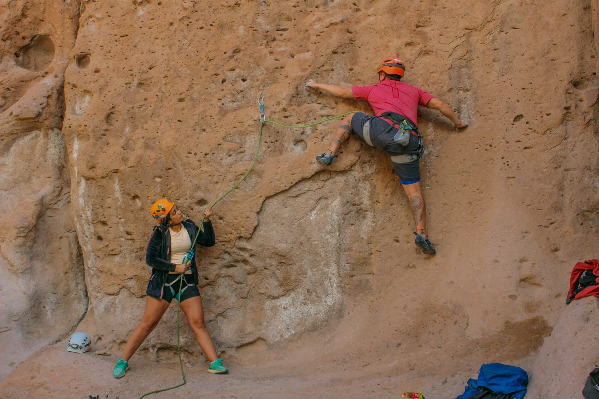 couple rock climbing