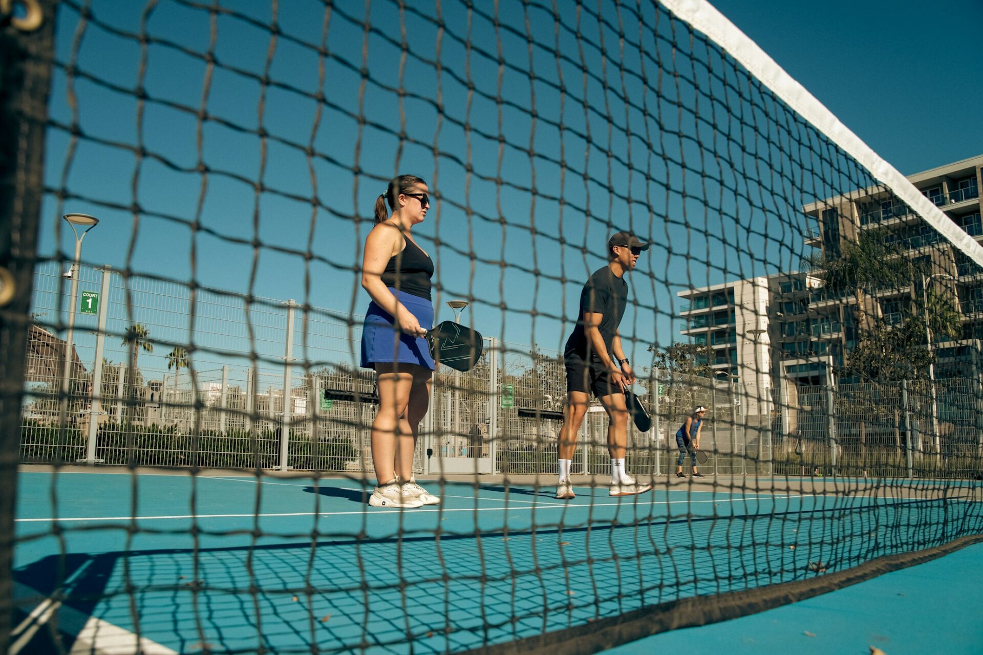 couple playing pickleball