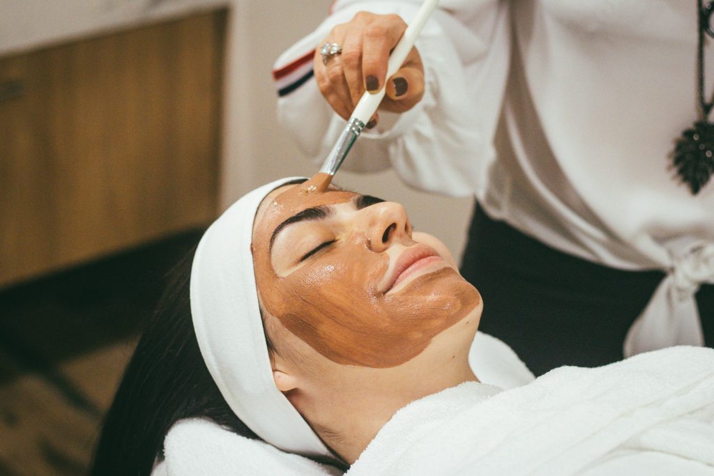 A woman receiving a facial.