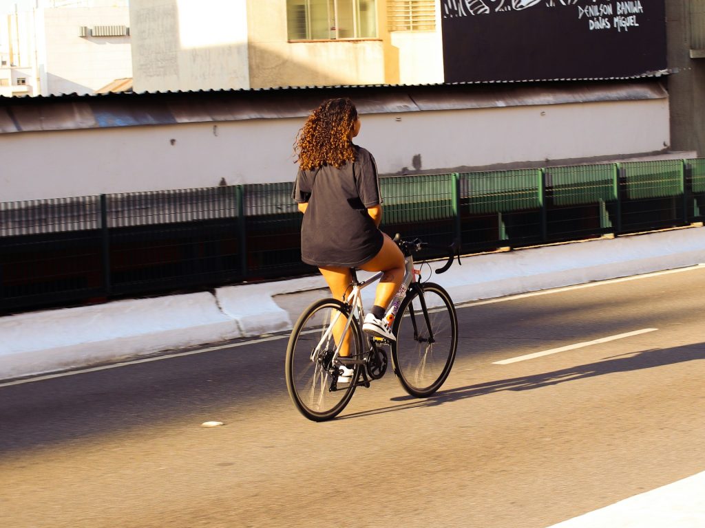 A woman riding a bike.