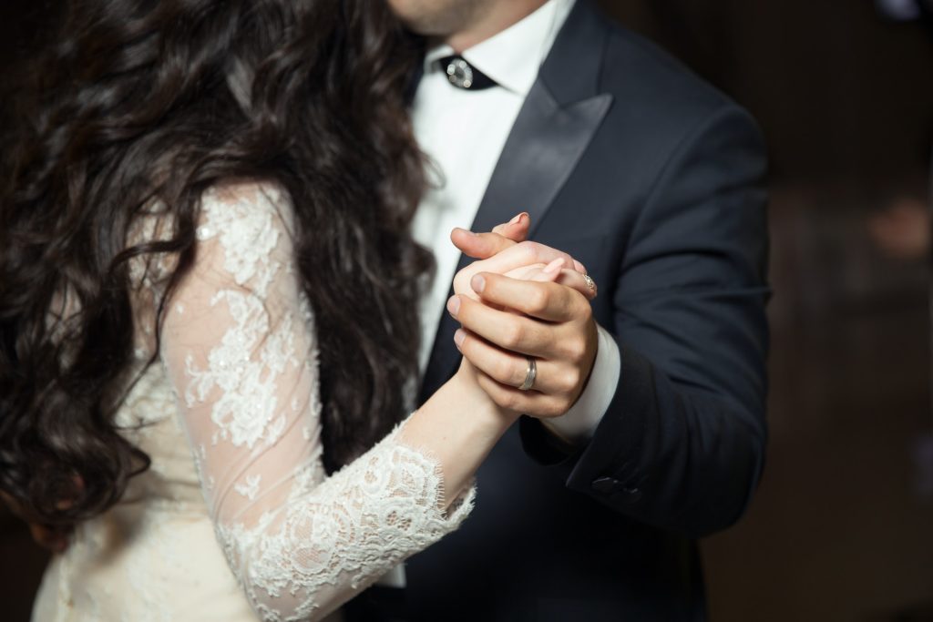 A bride and groom dancing.