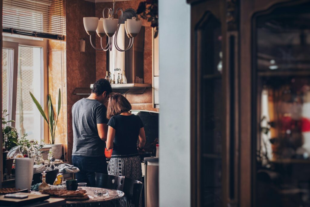 Man and woman cooking together for Valentine's date ideas
