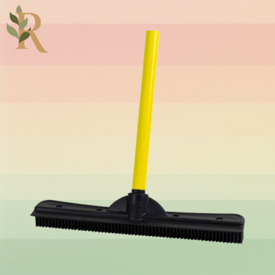 The FURemover's black bristle head and yellow handle sit against the Revivalist branded background. It's the best carpet broom for pet hair.