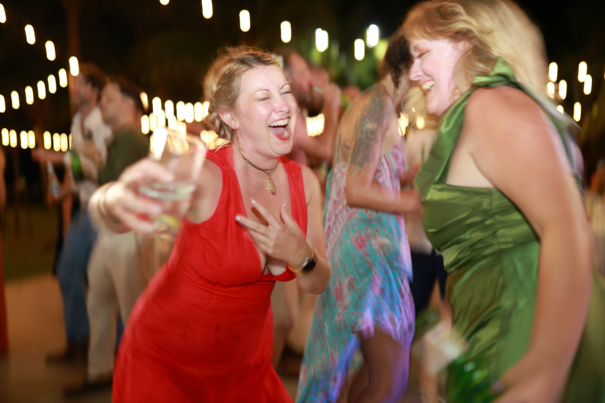 dancing and drinking wedding guests