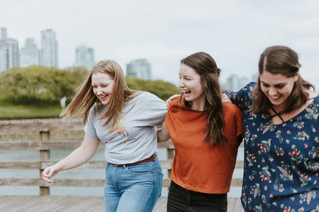3 women friends smiling