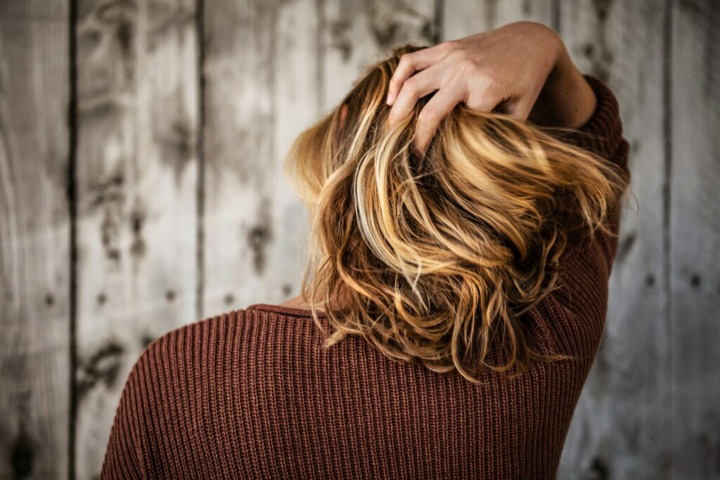 A woman holding her hair