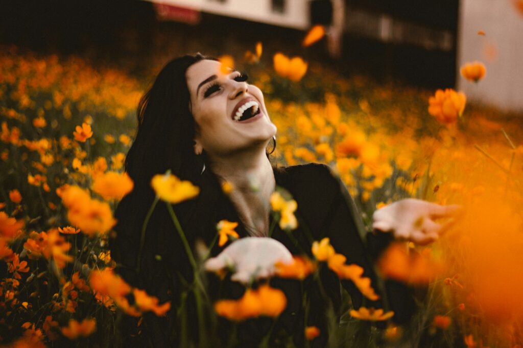 Woman smiling on flower field