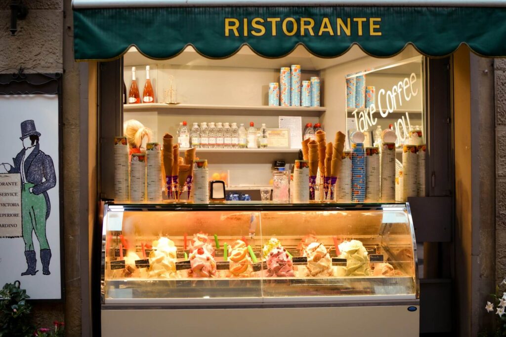 Ristorante ice cream shop storefront featuring a Take Coffee sign in the background