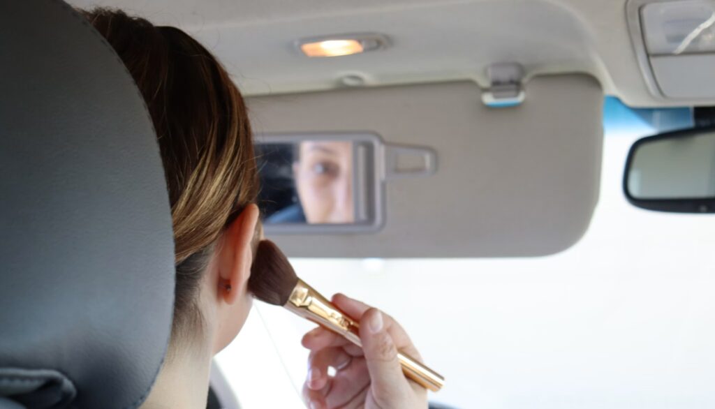 woman applying blush