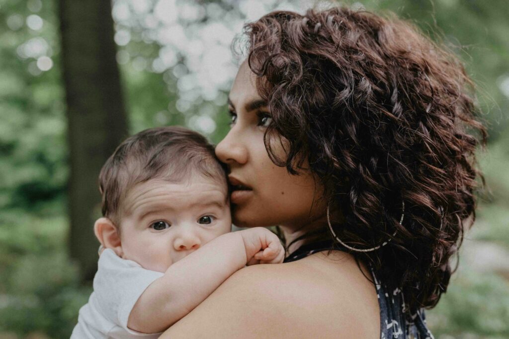 young woman holding baby