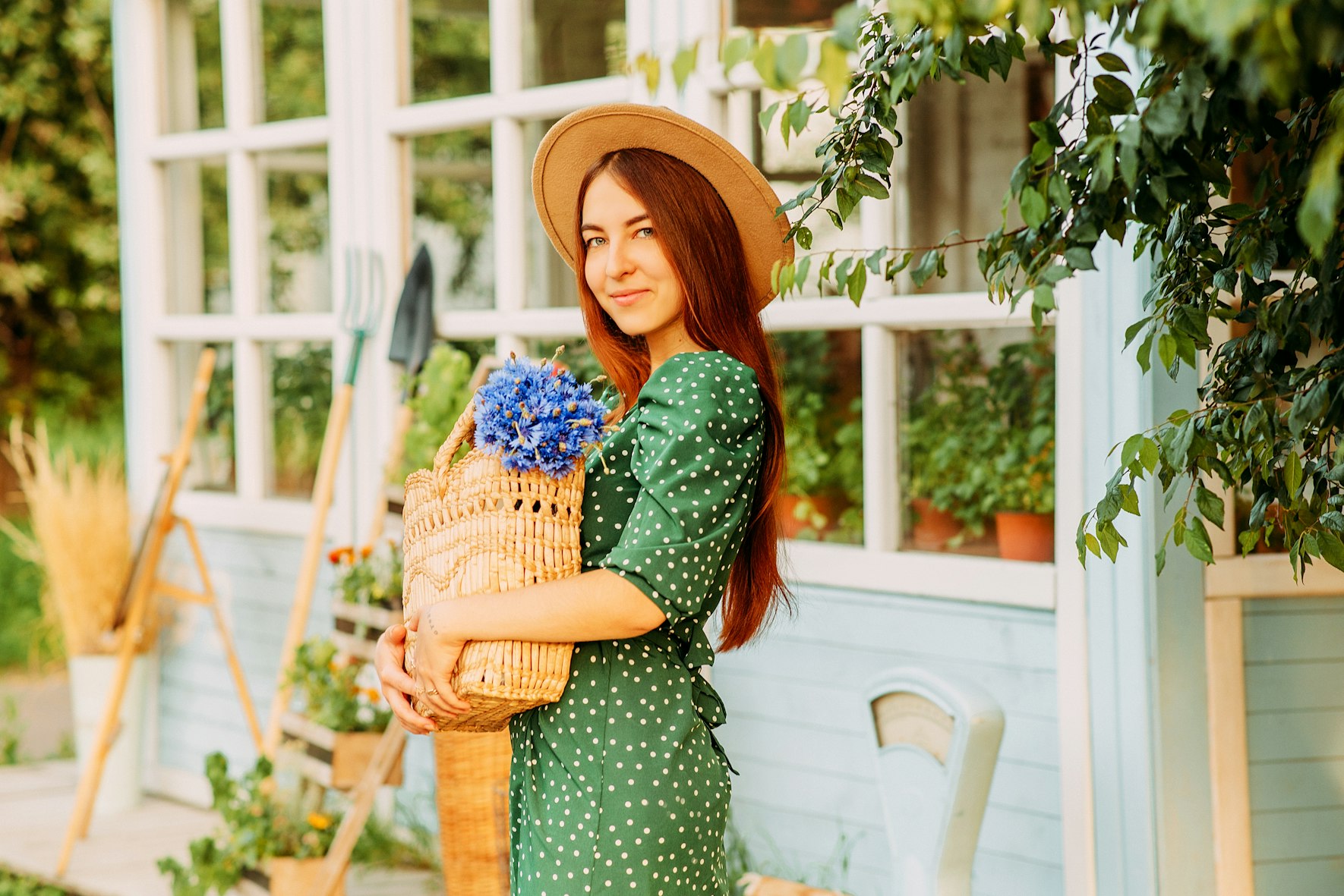 woman holding the basket of flowers
