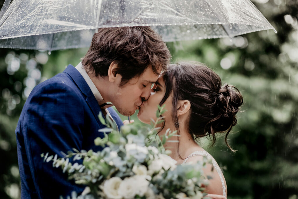 A rainy wedding day can have countless romantic moments.