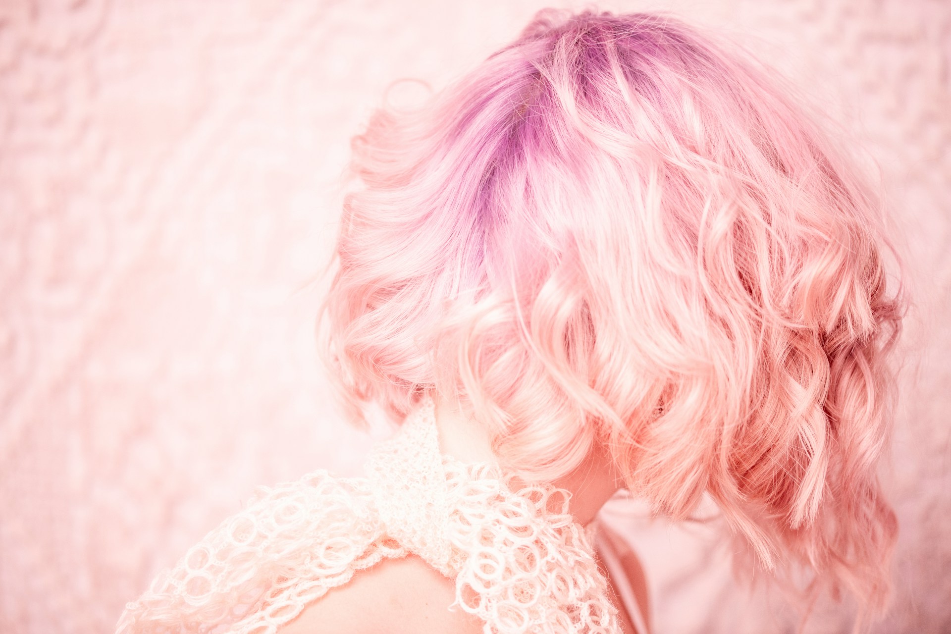 woman with pink hair from behind