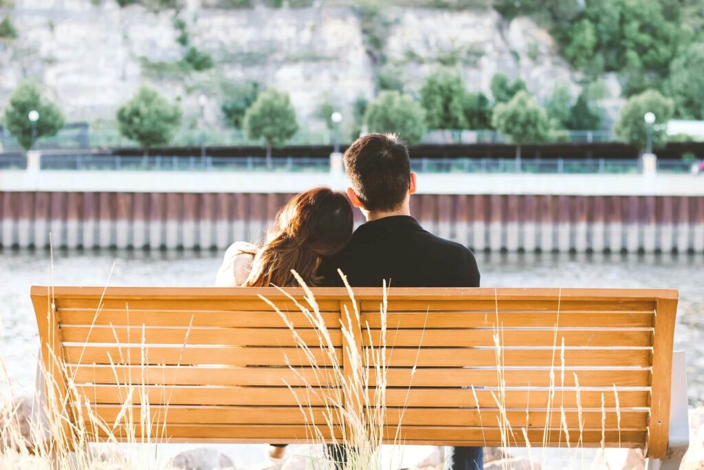 A couple leaning on each other