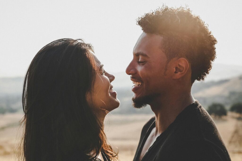 A couple smiling at each other