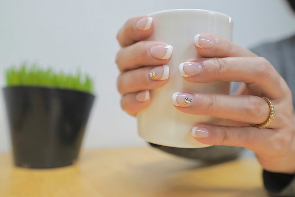 A french manicure on cup