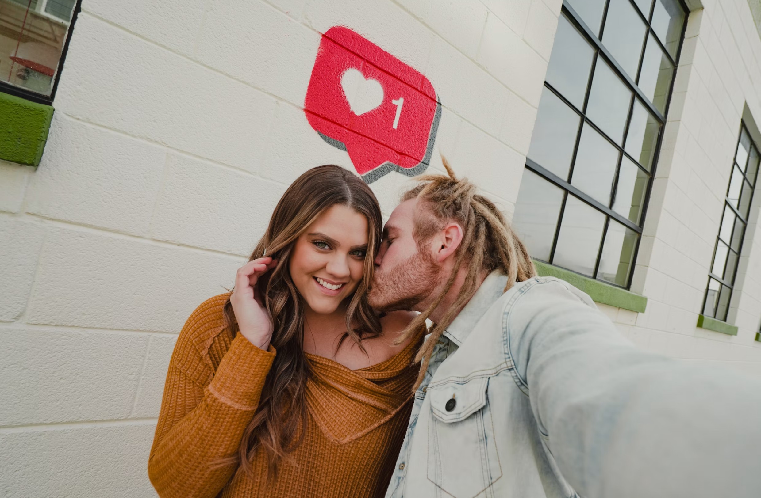 man kissing his girlfriend