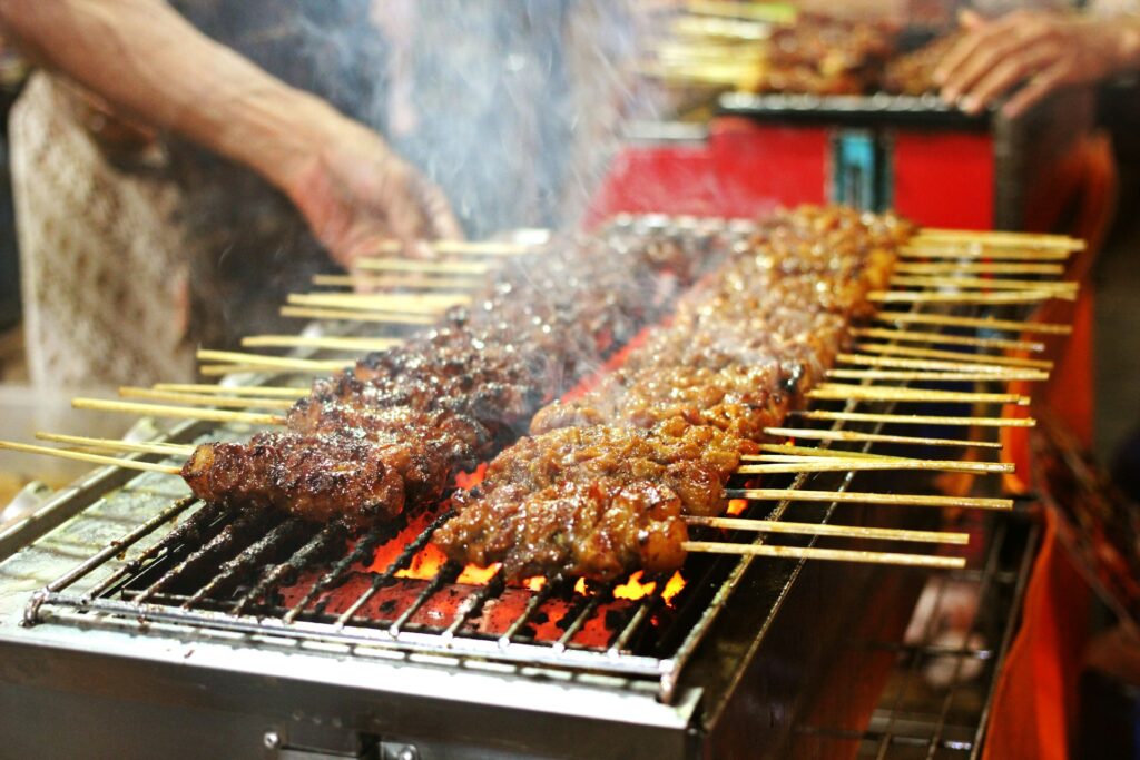 Meat on sticks on a grill