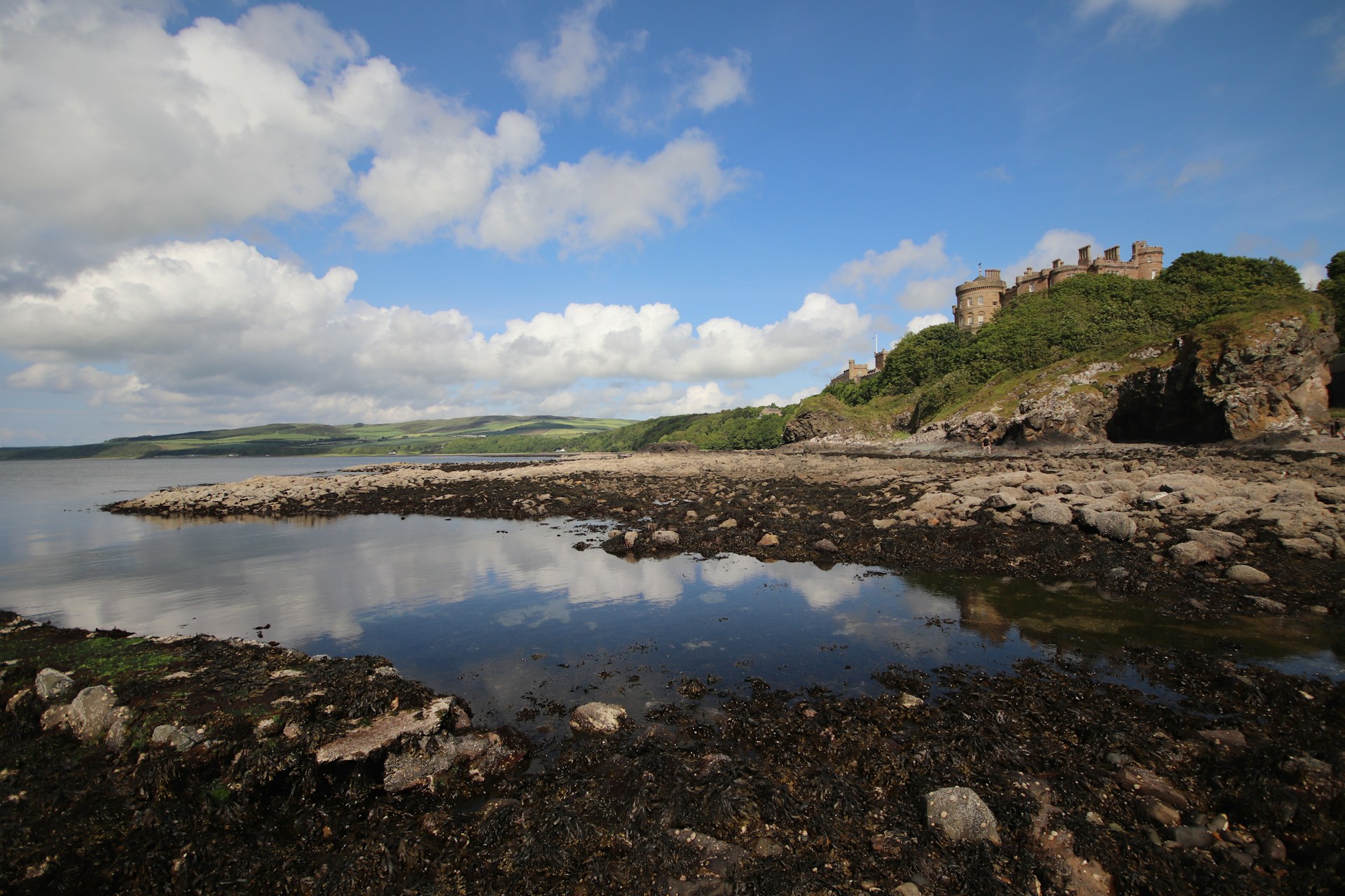 A cliffside along the water in Scotland.
