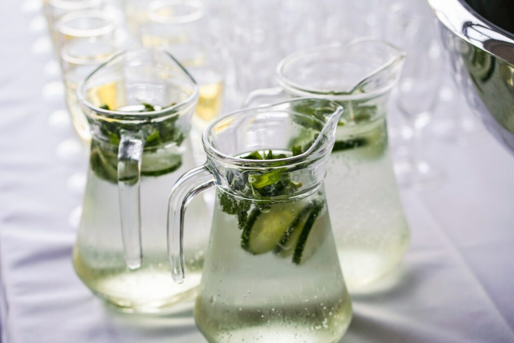 Three glasses of cucumber infused water.