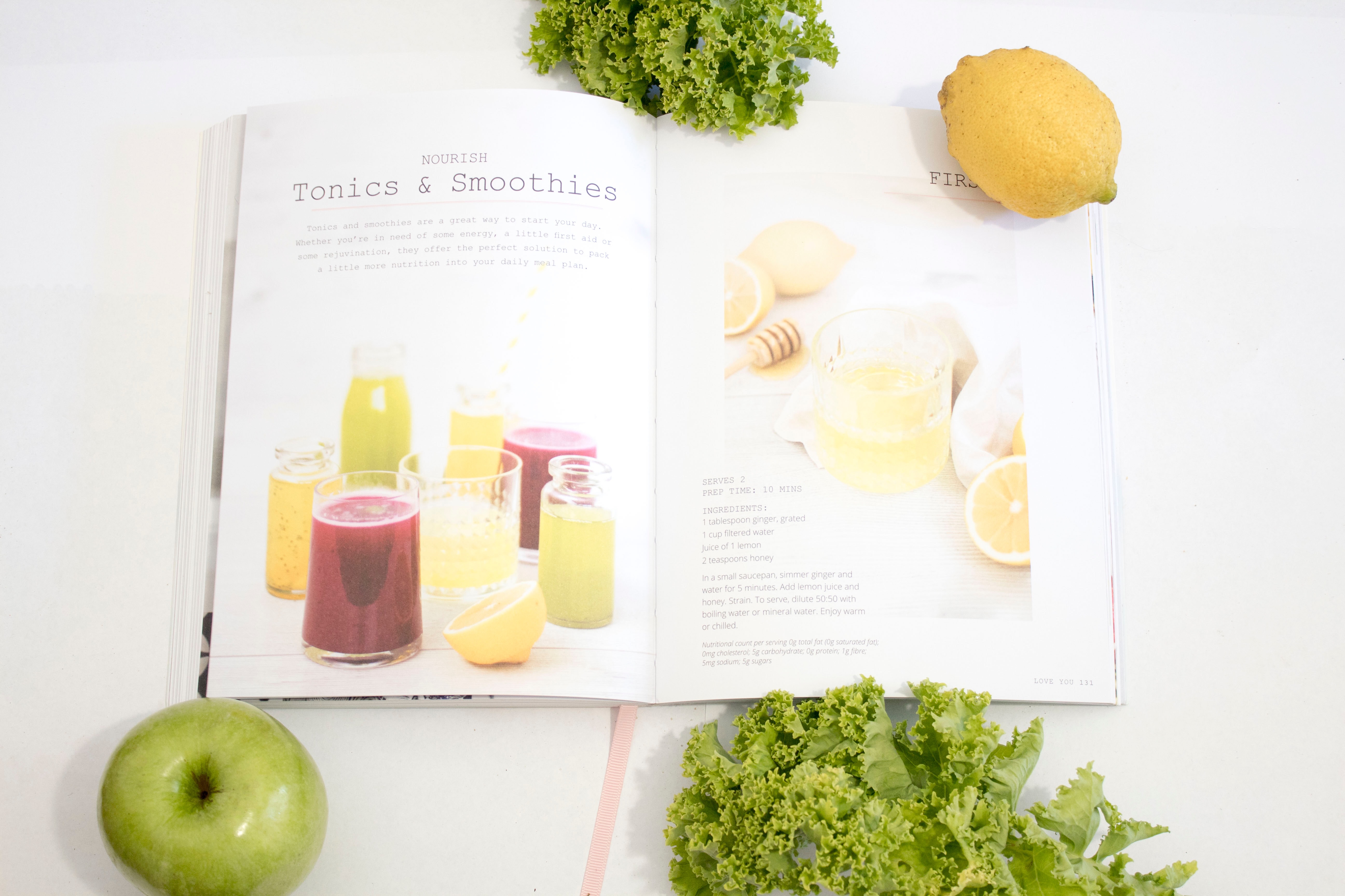A book lists recipes for tonics & smoothies.
