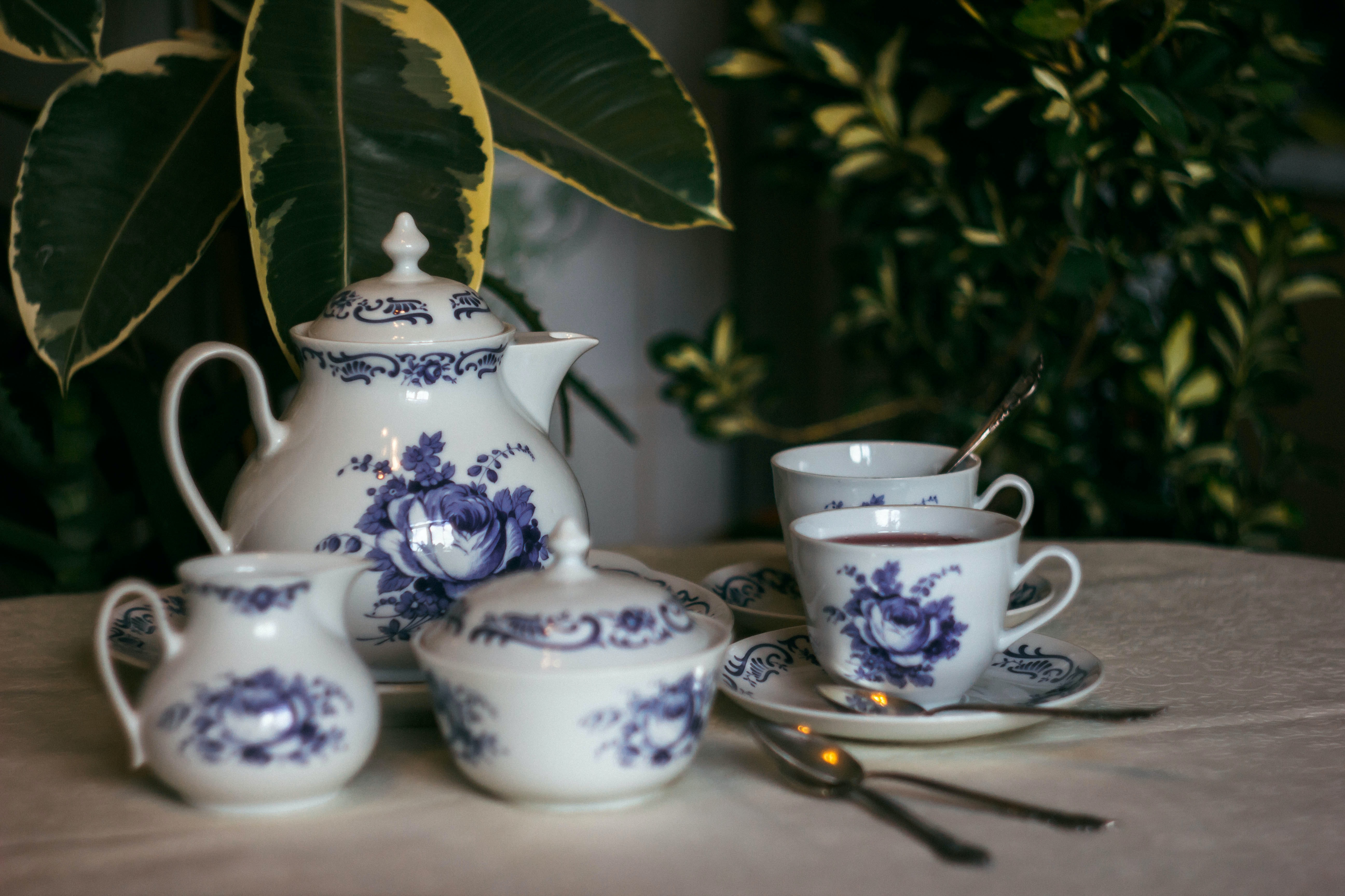 A tea set with blue floral designs.