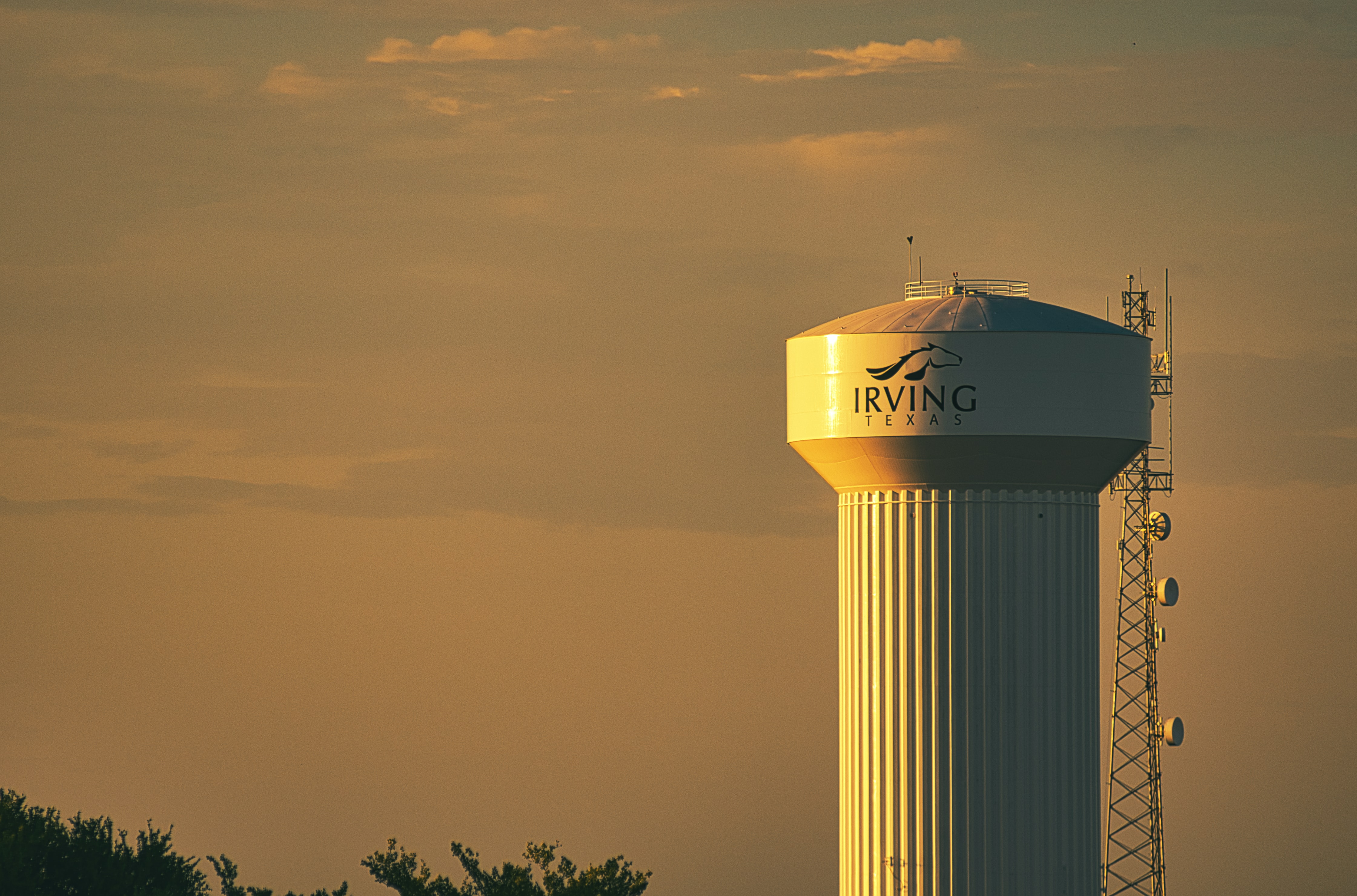 A water tower reads "Irving Texas." 